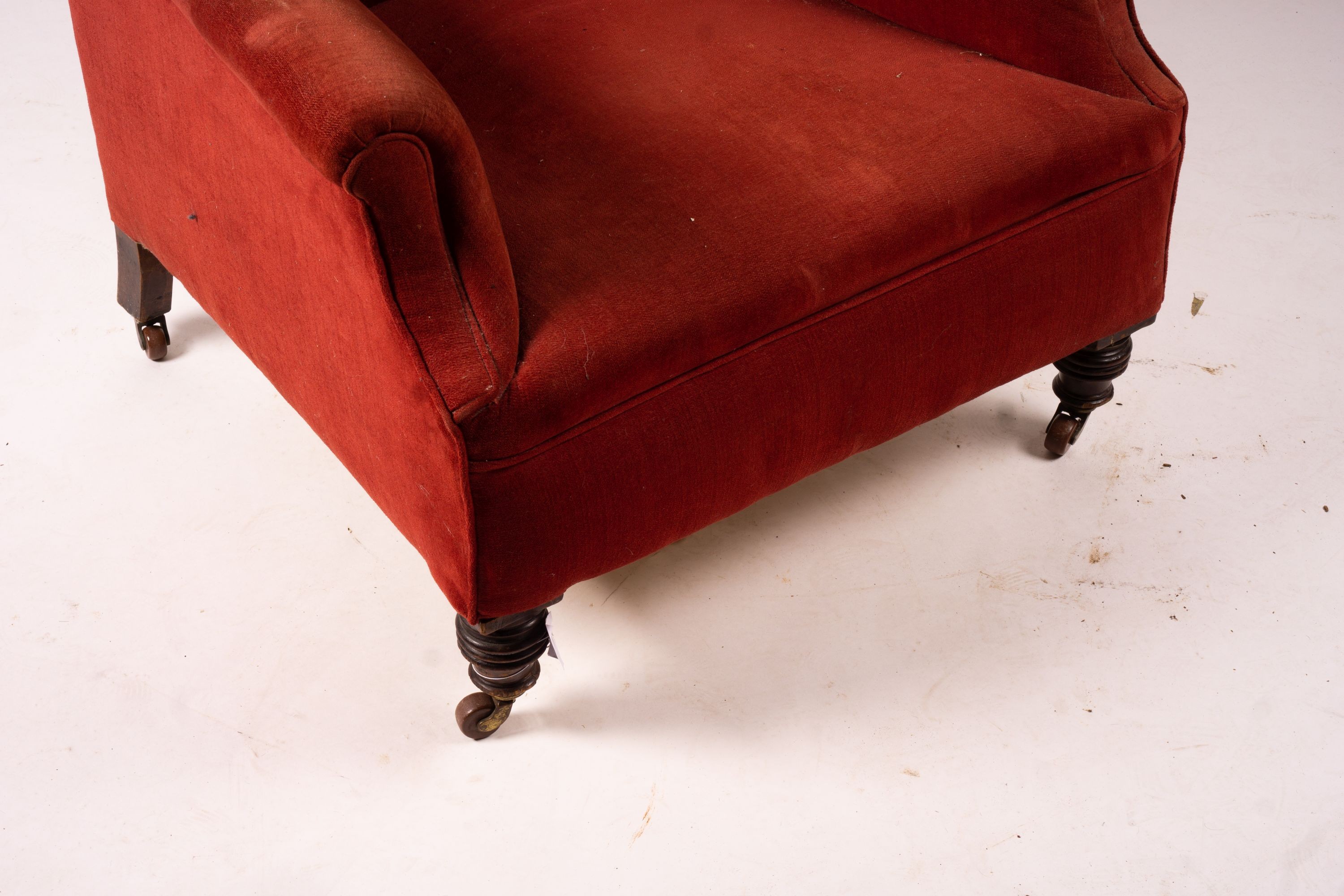 A late Victorian upholstered wing armchair, width 76cm, depth 70cm, height 100cm